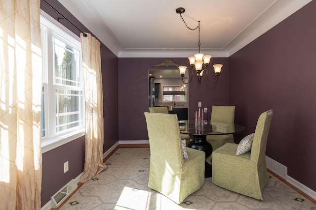 8811 Waruf Ave, Portage, MI 49002 - dining area with healthy amount of natural light and a chandelier
