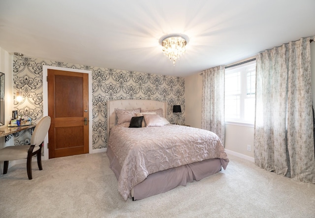 8811 Waruf Ave, Portage, MI 49002 - bedroom with carpet flooring, wallpapered walls, and a chandelier