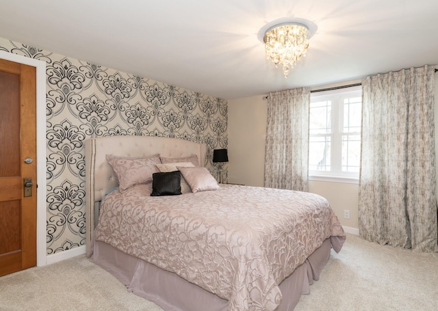 8811 Waruf Ave, Portage, MI 49002 - carpeted bedroom with a chandelier and baseboards