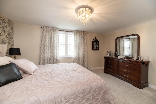8811 Waruf Ave, Portage, MI 49002 - bedroom featuring light carpet and a chandelier