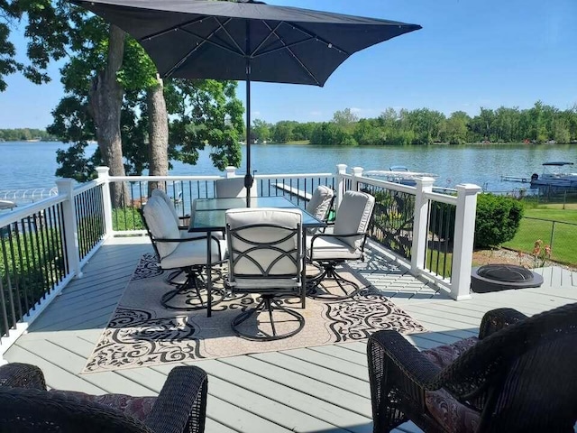 8811 Waruf Ave, Portage, MI 49002 - wooden deck featuring a water view and outdoor dining space