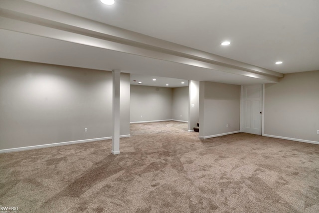 finished below grade area featuring carpet, baseboards, and recessed lighting