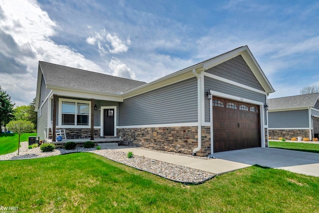 11146 Brahms Ln, Davison, MI 48423 - craftsman house featuring a porch, a garage, a front yard, concrete driveway, and central AC