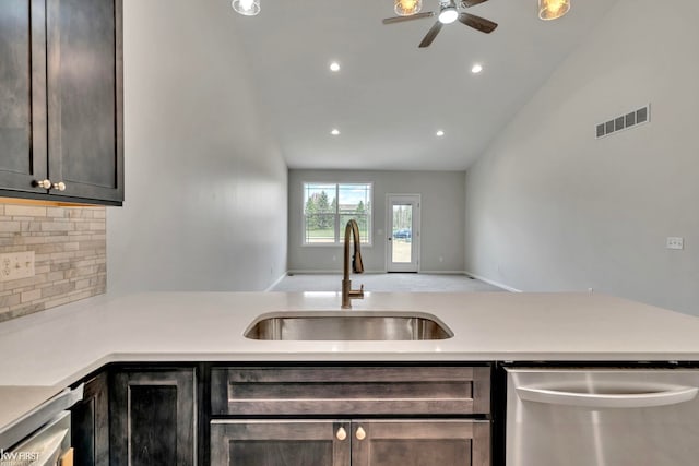 11146 Brahms Ln, Davison, MI 48423 - kitchen featuring a sink, dishwasher, tasteful backsplash, a ceiling fan, and light countertops
