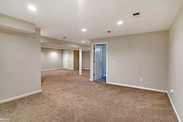 empty room with carpet floors, recessed lighting, and baseboards