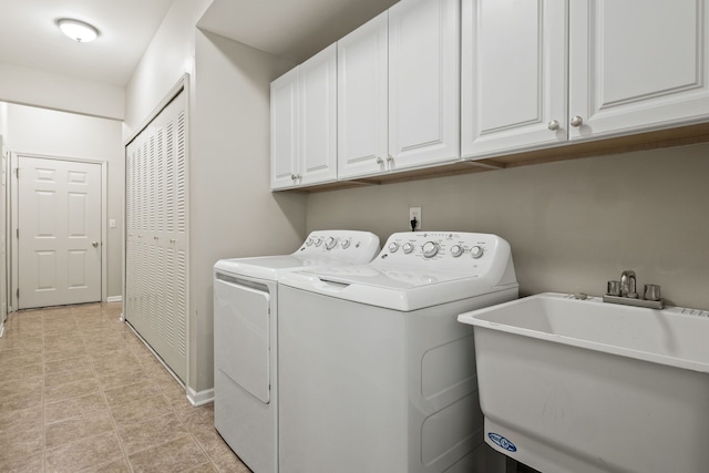1708 Deepwood Cir, Rochester, MI 48307 - laundry area featuring washing machine and clothes dryer, cabinet space, and baseboards