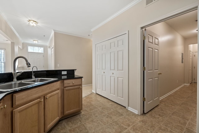 1708 Deepwood Cir, Rochester, MI 48307 - kitchen featuring a sink, dark countertops, crown molding, baseboards, and brown cabinetry