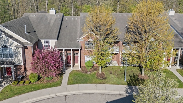 1708 Deepwood Cir, Rochester, MI 48307 - view of front of property featuring a front yard, brick siding, and roof with shingles