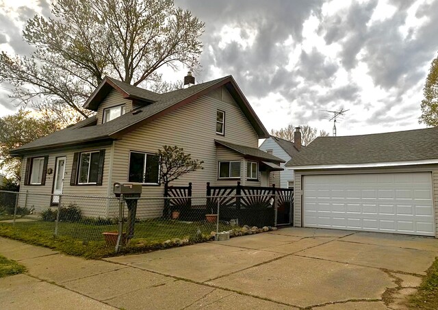 view of home's exterior with fence, a chimney, and a garage