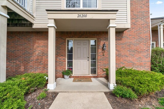 entrance to property with brick siding