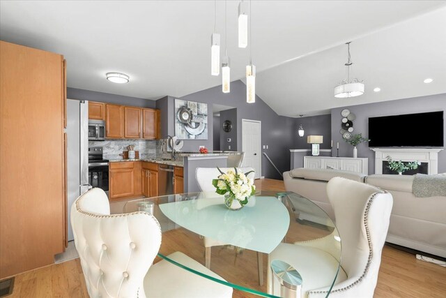 dining area featuring light wood-style flooring