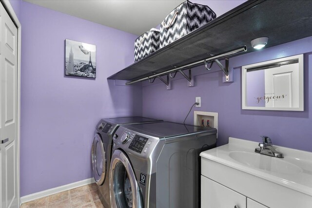 washroom featuring separate washer and dryer and baseboards