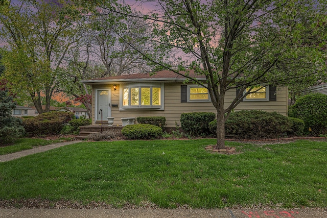 view of front of home featuring a yard
