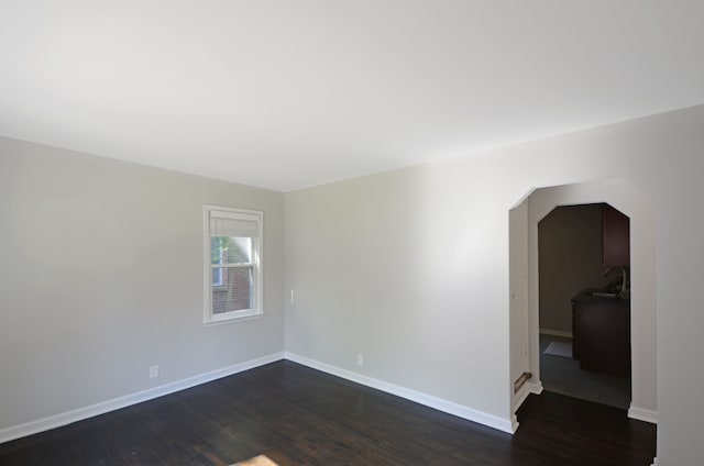 3023 N Vermont Ave, Royal Oak, MI 48073 - spare room featuring dark wood finished floors and baseboards