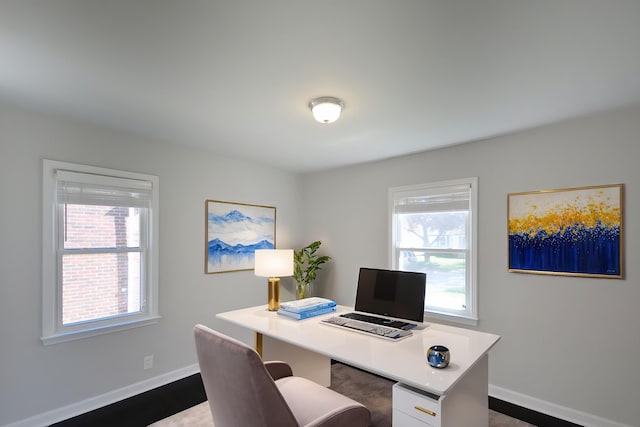 home office with healthy amount of natural light and baseboards