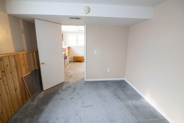 1291 103rd Ave, Plainwell, MI 49080 - carpeted spare room with wood walls and a smoke detector