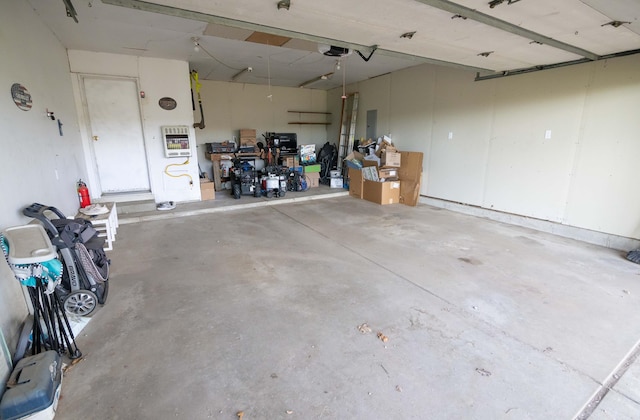 1291 103rd Ave, Plainwell, MI 49080 - garage featuring a garage door opener and electric panel