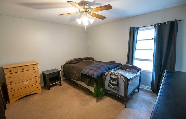 1291 103rd Ave, Plainwell, MI 49080 - bedroom featuring multiple windows, light carpet, and a ceiling fan