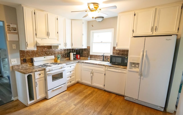 1291 103rd Ave, Plainwell, MI 49080 - kitchen with white appliances, a sink, under cabinet range hood, a ceiling fan, and backsplash