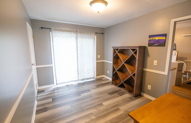 1291 103rd Ave, Plainwell, MI 49080 - spare room featuring wood finished floors and baseboards