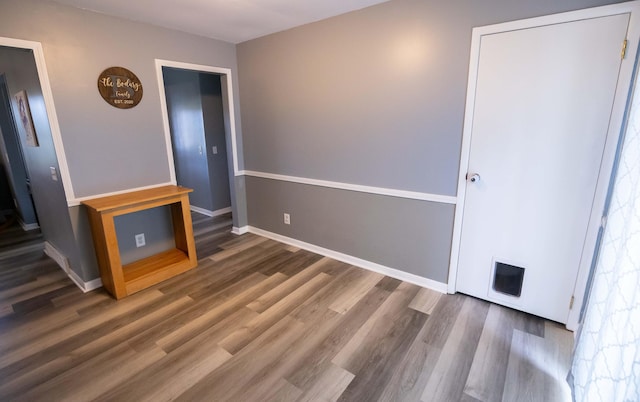 1291 103rd Ave, Plainwell, MI 49080 - unfurnished room featuring wood finished floors and baseboards
