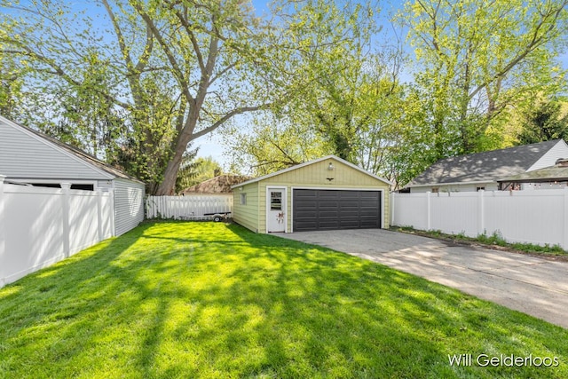 view of yard with a garage and an outdoor structure