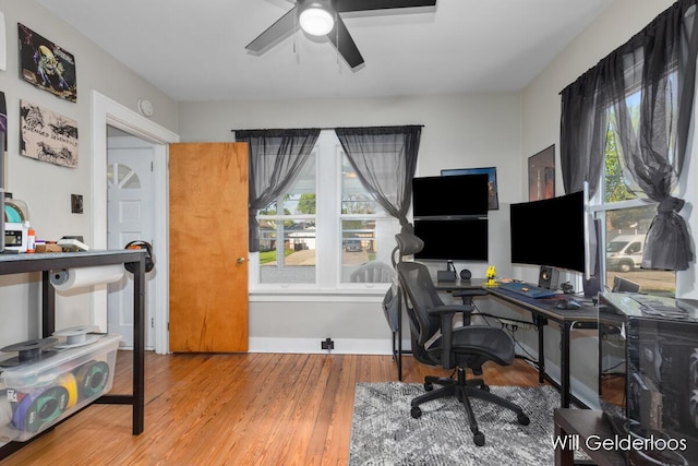 office area with a ceiling fan and wood finished floors