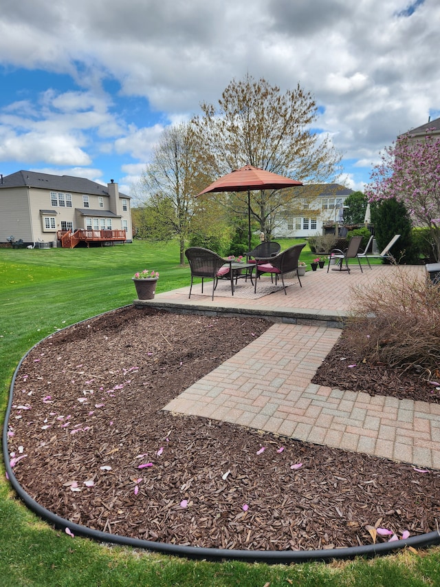 surrounding community with a patio area and a yard