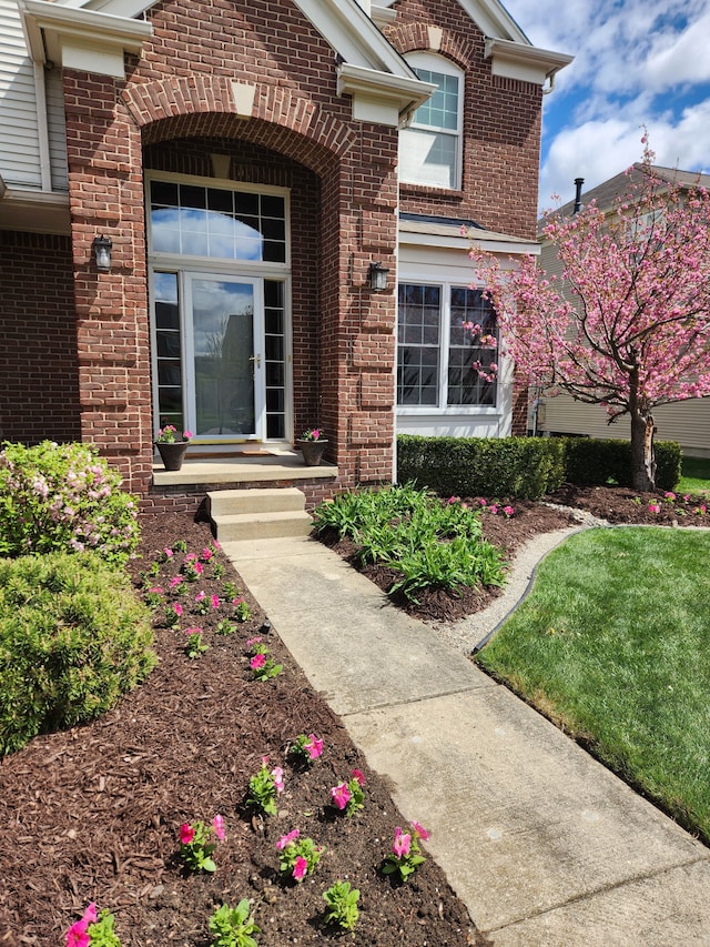 entrance to property with brick siding
