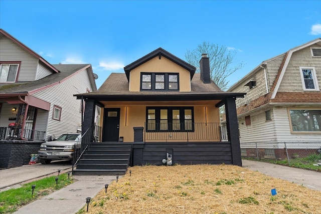 475 Algonquin St, Detroit, MI 48215 - bungalow featuring a porch, a chimney, and fence