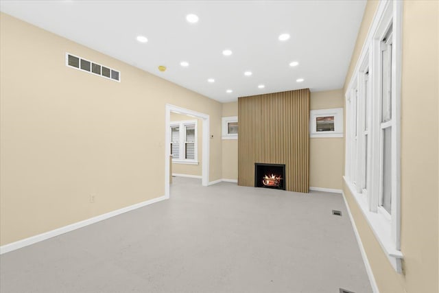 475 Algonquin St, Detroit, MI 48215 - unfurnished living room with recessed lighting, a fireplace, baseboards, and carpet flooring