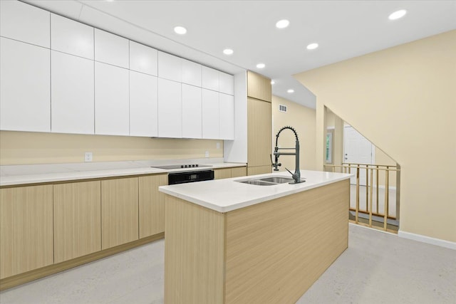 475 Algonquin St, Detroit, MI 48215 - kitchen featuring a sink, modern cabinets, light brown cabinets, recessed lighting, and an island with sink