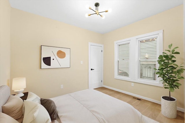 475 Algonquin St, Detroit, MI 48215 - bedroom with wood finished floors, a chandelier, and baseboards