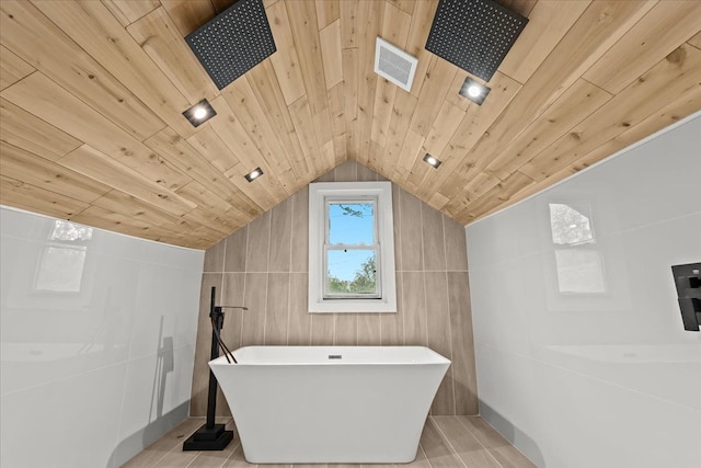 475 Algonquin St, Detroit, MI 48215 - bathroom featuring a soaking tub, lofted ceiling, a tile shower, wooden ceiling, and tile patterned flooring