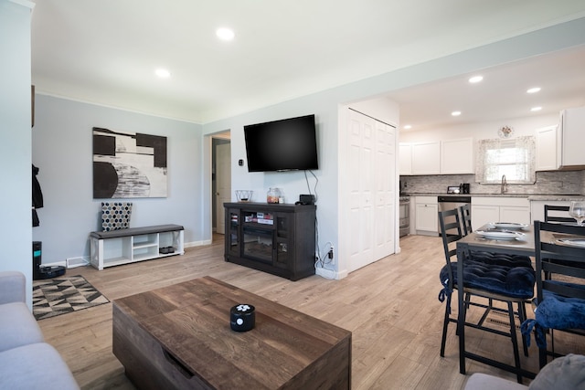 2170 Sonoma St, Ferndale, MI 48220 - living area featuring light wood-style flooring, ornamental molding, baseboards, and recessed lighting