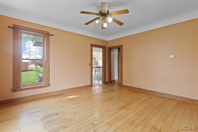 11160 W Ridgeville Rd, Morenci, MI 49256 - unfurnished room with healthy amount of natural light, light wood-type flooring, ceiling fan, and baseboards