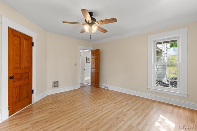11160 W Ridgeville Rd, Morenci, MI 49256 - empty room with light wood-style flooring, baseboards, and a ceiling fan