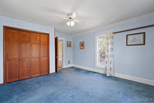 11160 W Ridgeville Rd, Morenci, MI 49256 - unfurnished bedroom featuring dark colored carpet, baseboards, a ceiling fan, and a closet