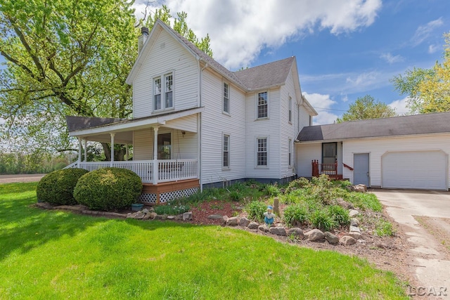 11160 W Ridgeville Rd, Morenci, MI 49256 - view of front of home with a front lawn, covered porch, a garage, driveway, and a chimney