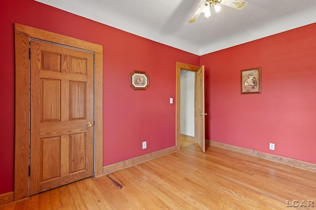11160 W Ridgeville Rd, Morenci, MI 49256 - unfurnished bedroom with light wood finished floors, baseboards, and a ceiling fan