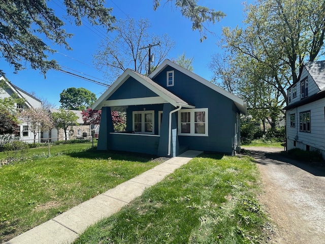 back of property with a lawn and a chimney