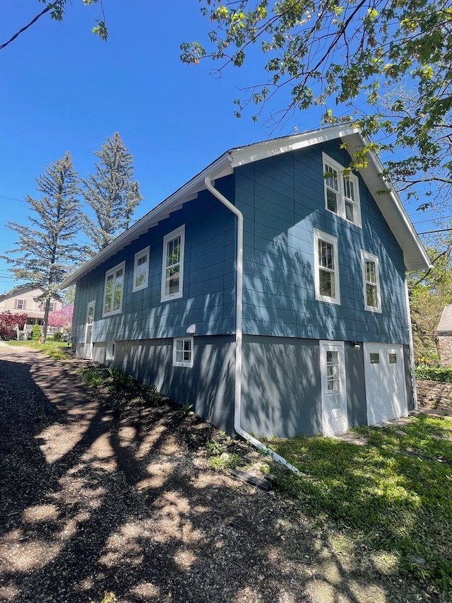 view of property exterior with a garage