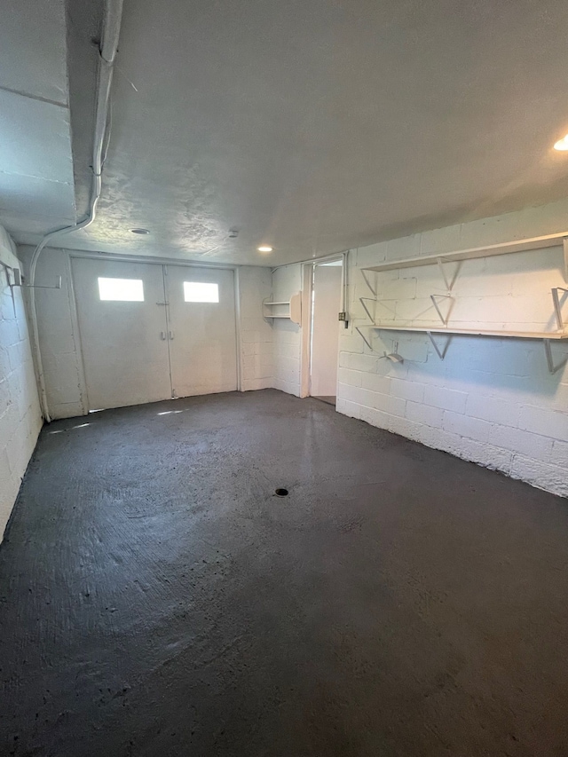 basement featuring concrete block wall