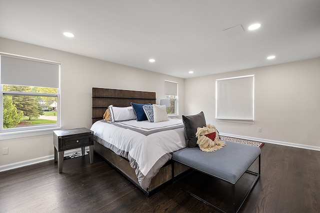 bedroom with dark wood-style floors, recessed lighting, and baseboards