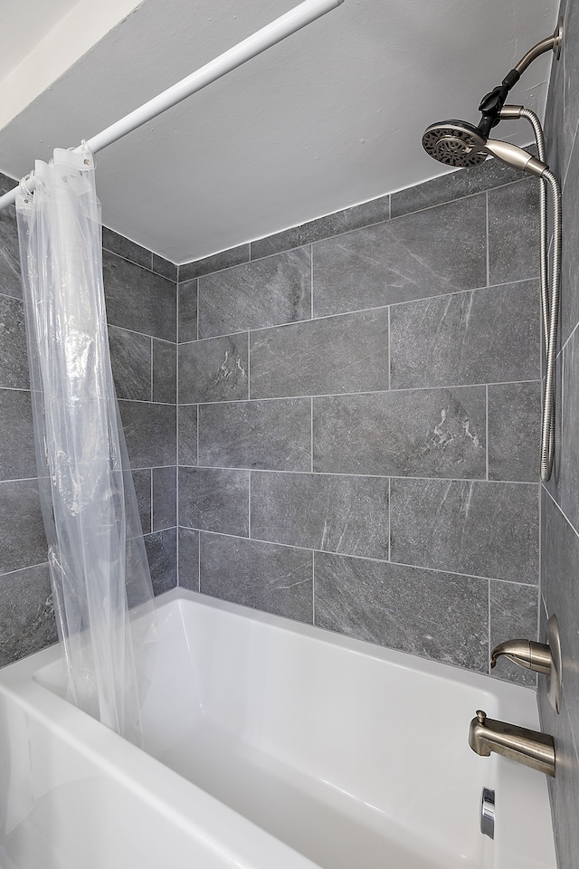 full bathroom with shower / bath combo