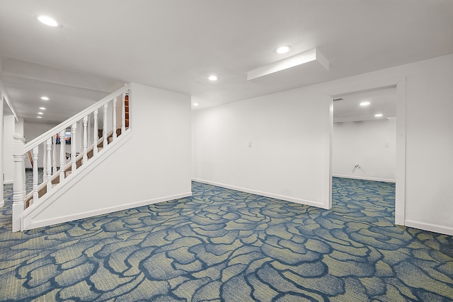 finished basement with carpet, stairway, recessed lighting, and baseboards