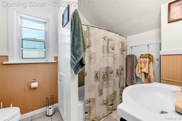 414 Riverview Ave, Monroe, MI 48162 - bathroom featuring toilet, a textured ceiling, a sink, tile patterned flooring, and shower / tub combo with curtain