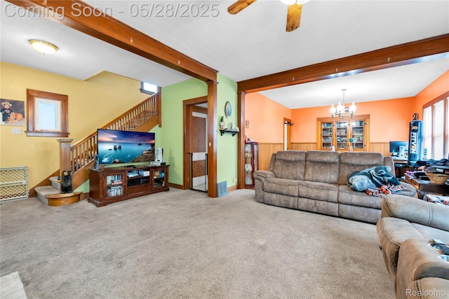 414 Riverview Ave, Monroe, MI 48162 - carpeted living area featuring stairs, beam ceiling, a ceiling fan, and a chandelier
