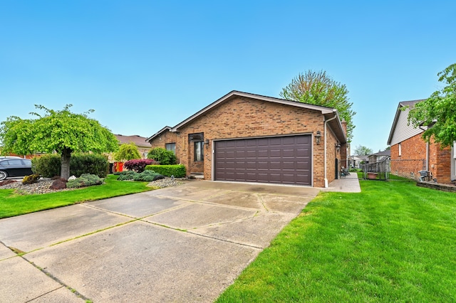 47296 Sanborn Dr, Macomb, MI 48044 - view of front of house with brick siding, a garage, and driveway