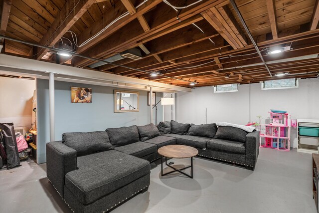 living area featuring concrete flooring and healthy amount of natural light